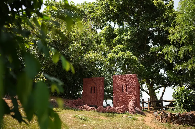 Brick art installations on the hillside lawn at Purayil Resort