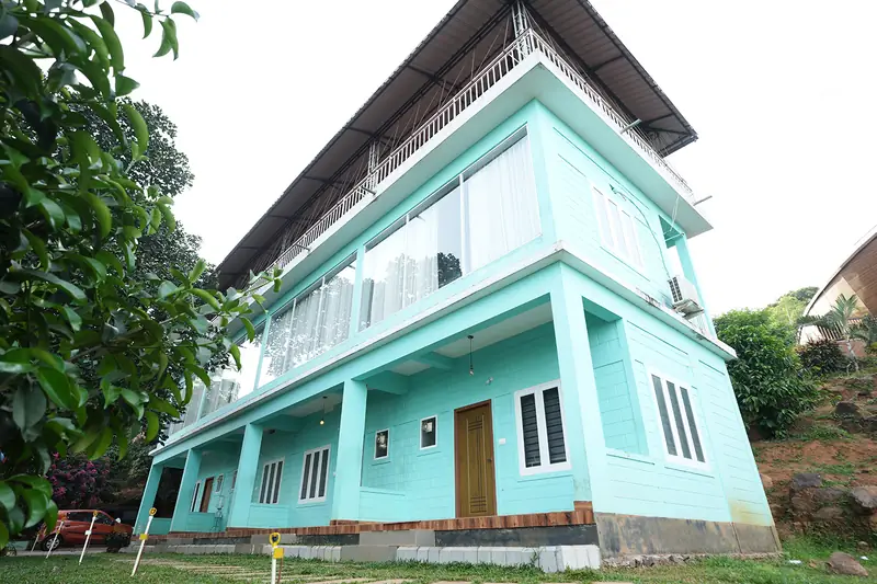 Capsule Villa building with glass-fronted rooms at Purayil Resort Kakkadampoyil