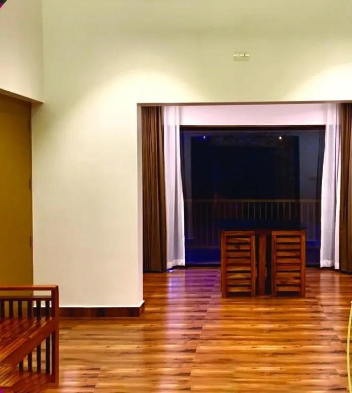Spacious living hall with wooden floors in the Crown Villa