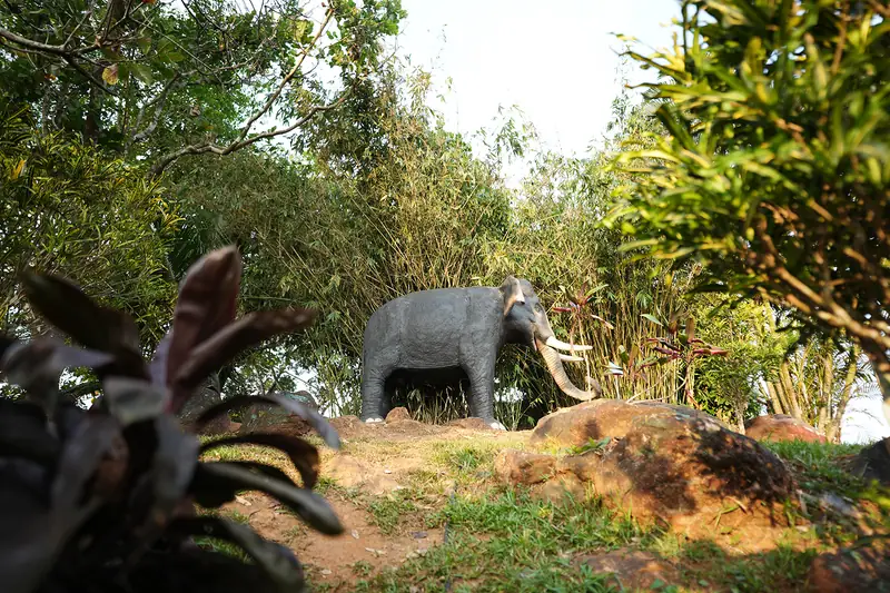 Elephant sculpture in the resort gardens at golden hour