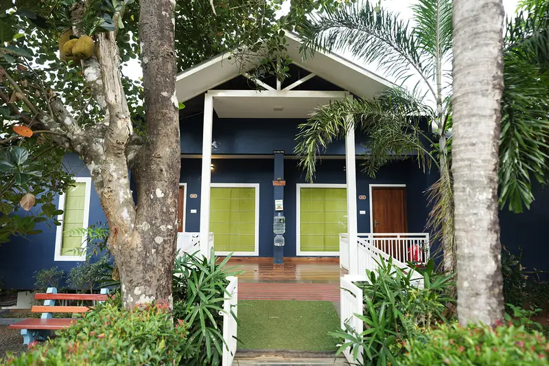 Lavista Villa couple cottage framed by trees and gardens at Purayil Resort